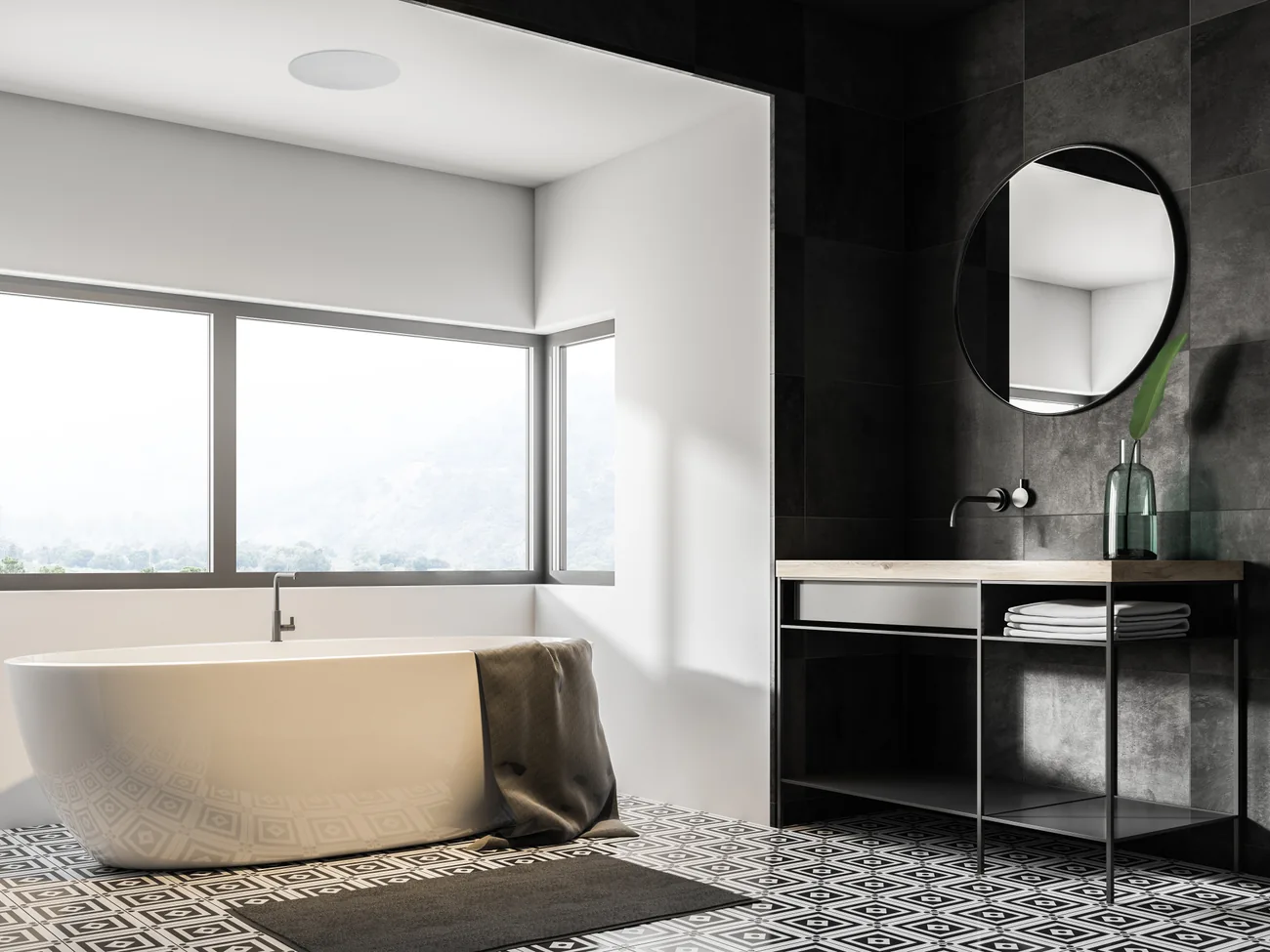 A bathroom with a freestanding bath and a Lithe Audio IP44 speaker set into the ceiling